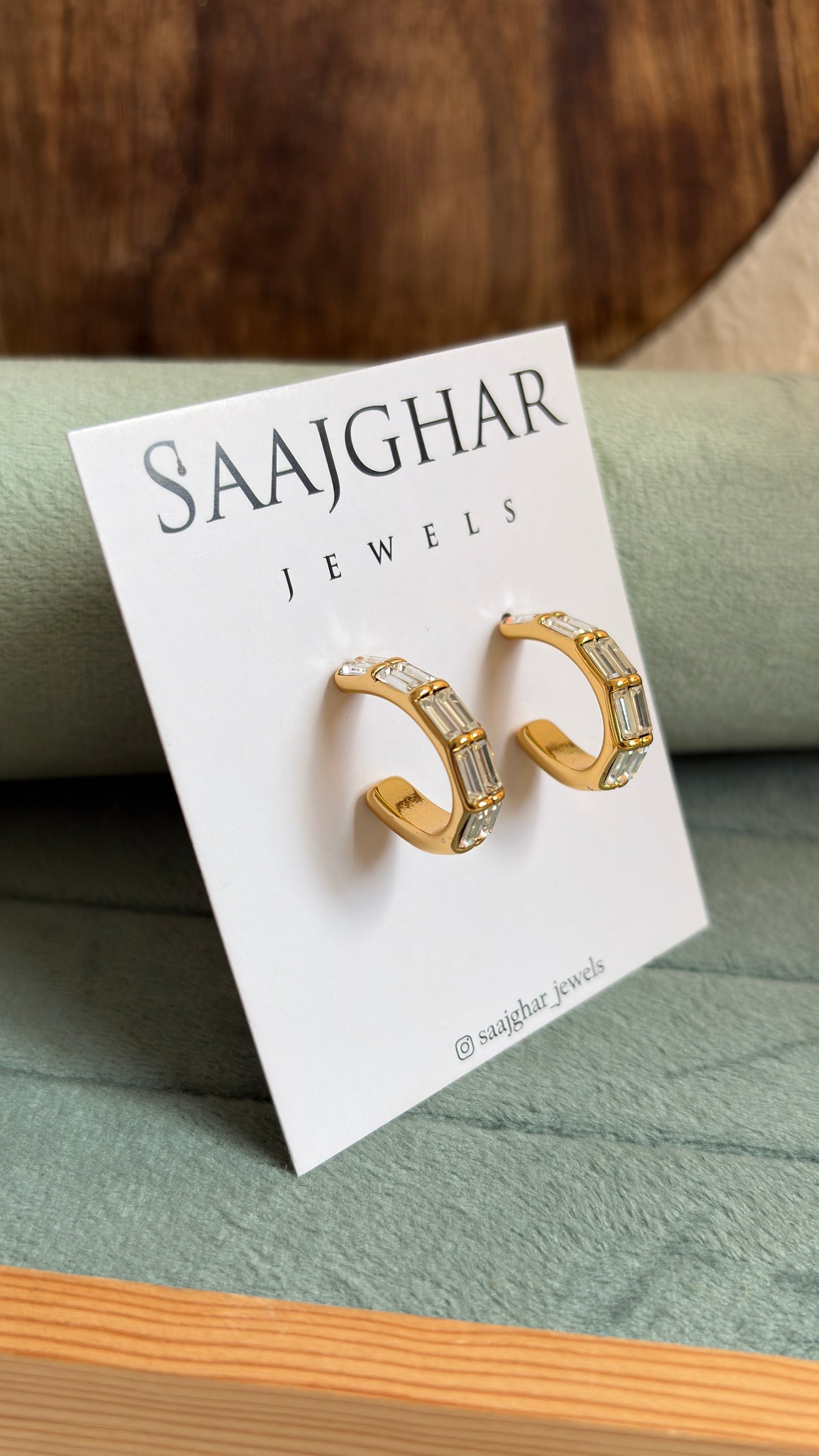 White stone hoops type earrings