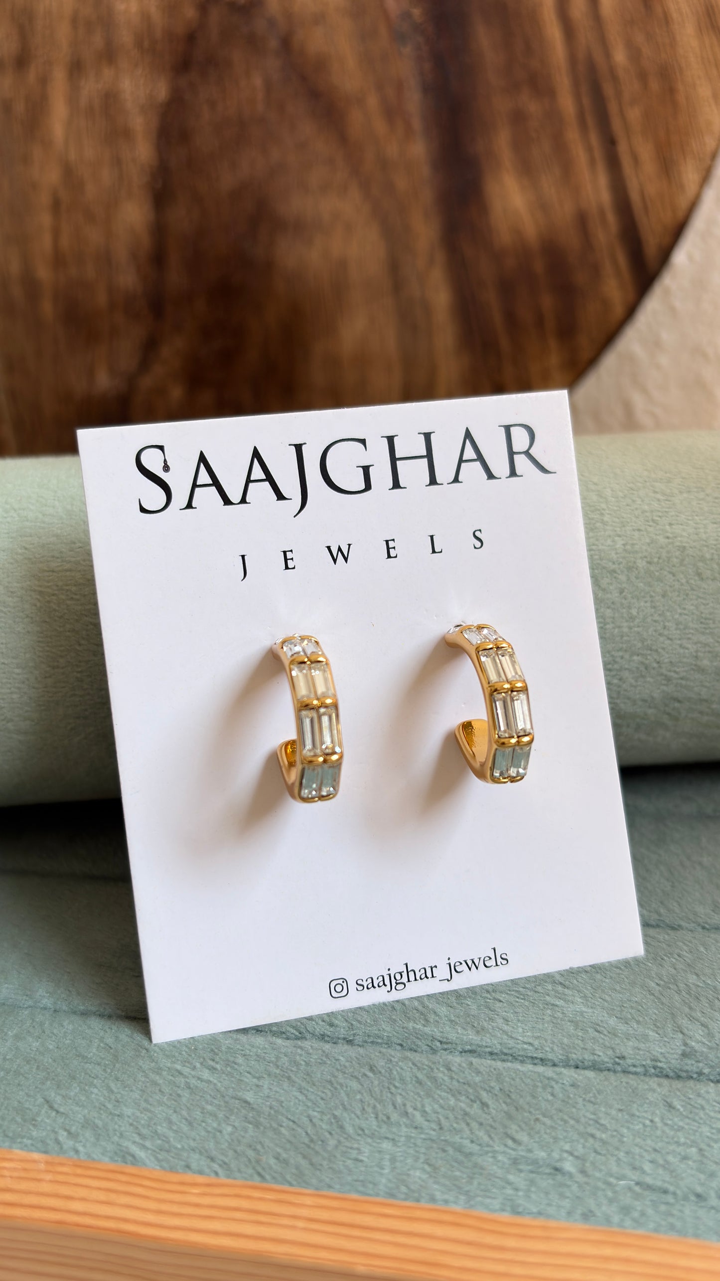 White stone hoops type earrings